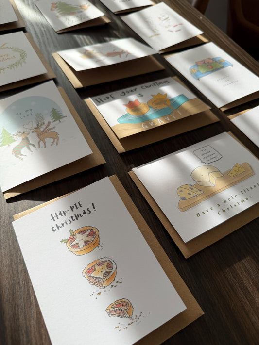 Collection of greeting cards on a wooden surface